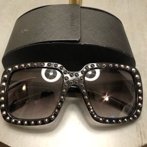 Bkack Prada sunglasses with silver studds.